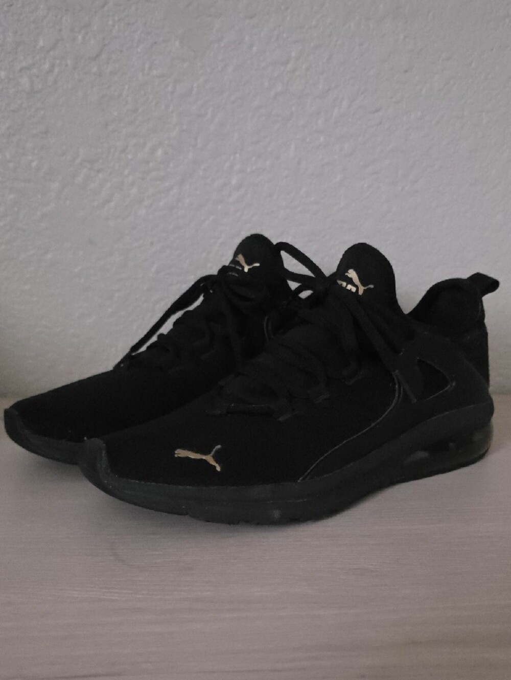 Puma Black Low-Top Sneakers with Gold Branding